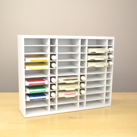 Angle view of a 30 Ink Pad and Refill organizer filled with pads and reink bottles.