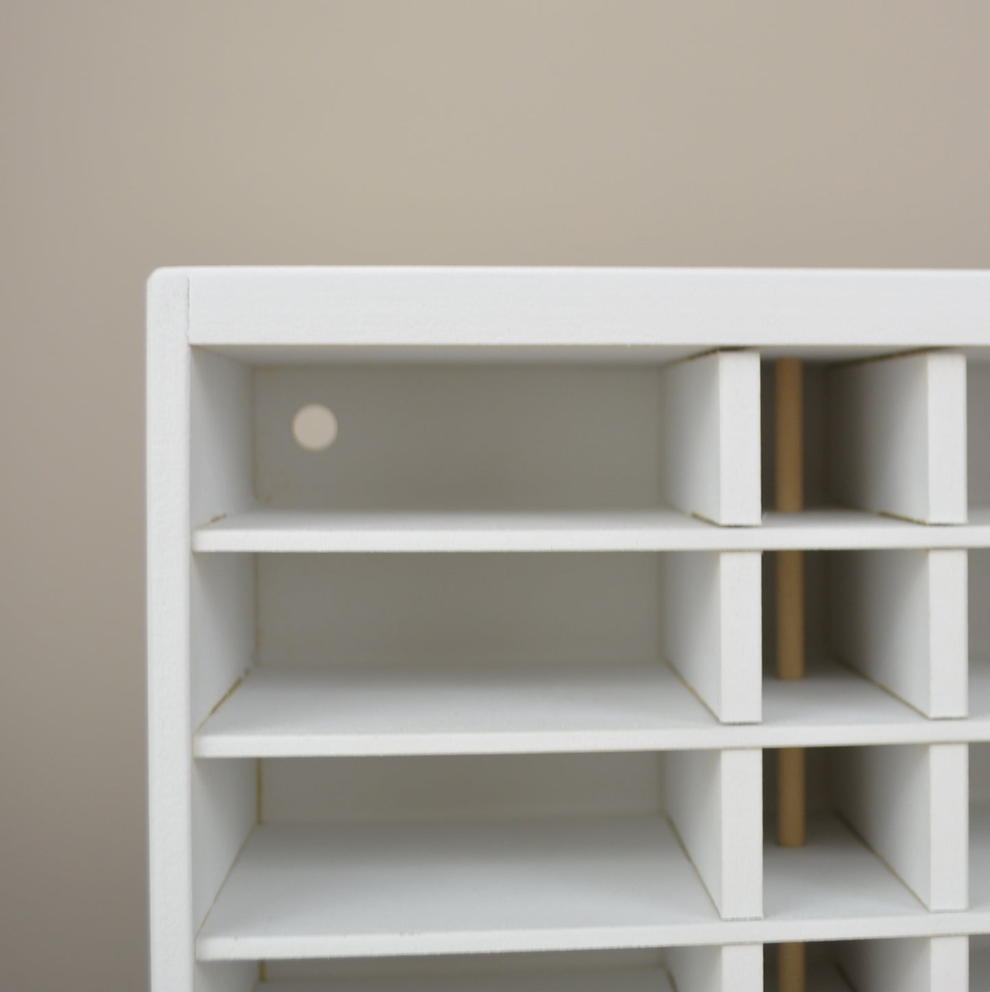 Closeup view of the cubbies in an ink pad and refill bottle organizer.