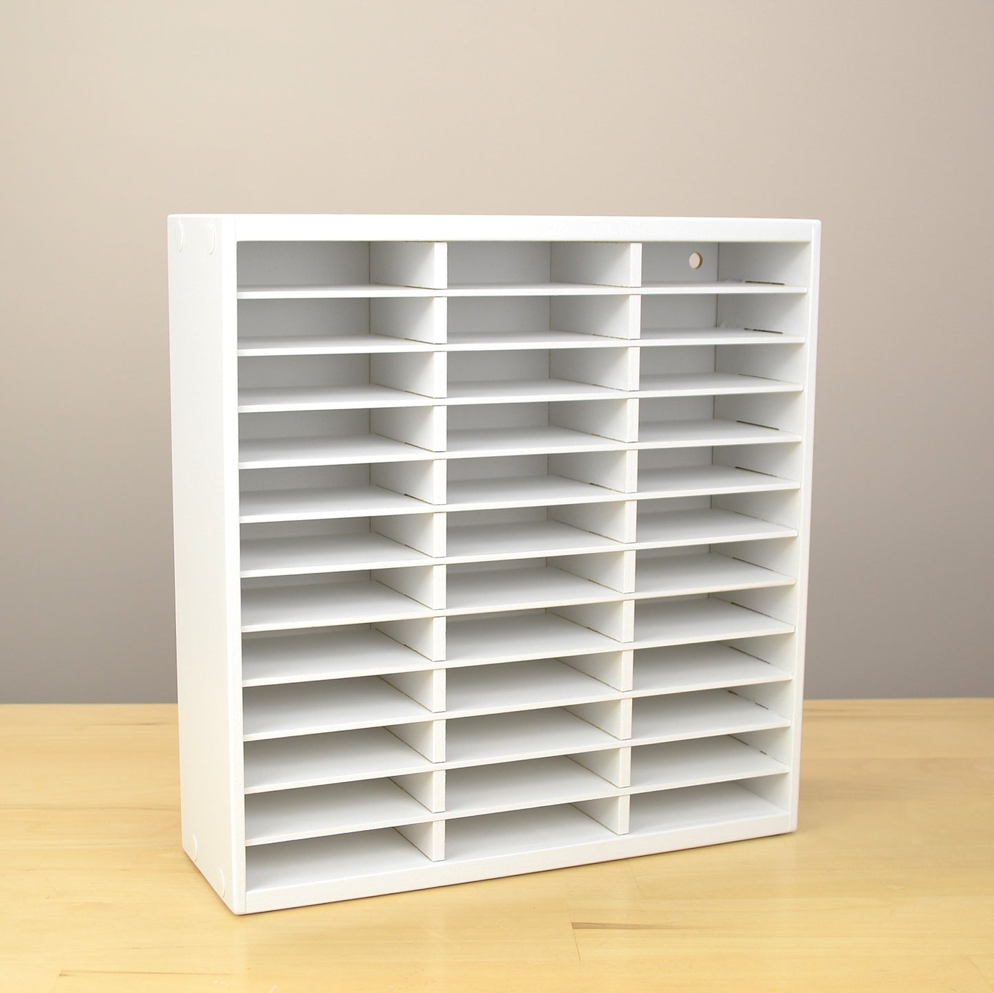 Angle view of a 36 Ink Pad organizer painted white and made by OrganizeMore.