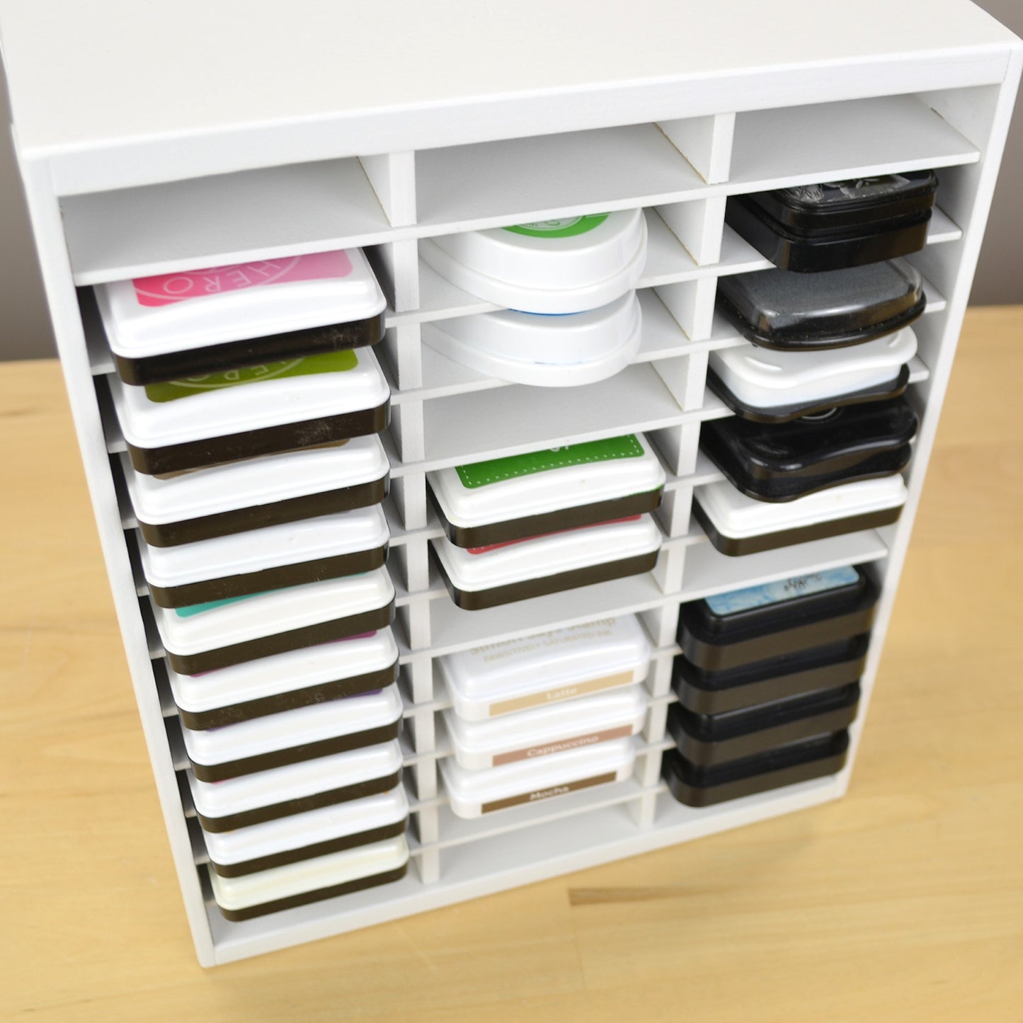 Angle view on standard sized ink pads in an OrganizeMore 36 ink organizer.