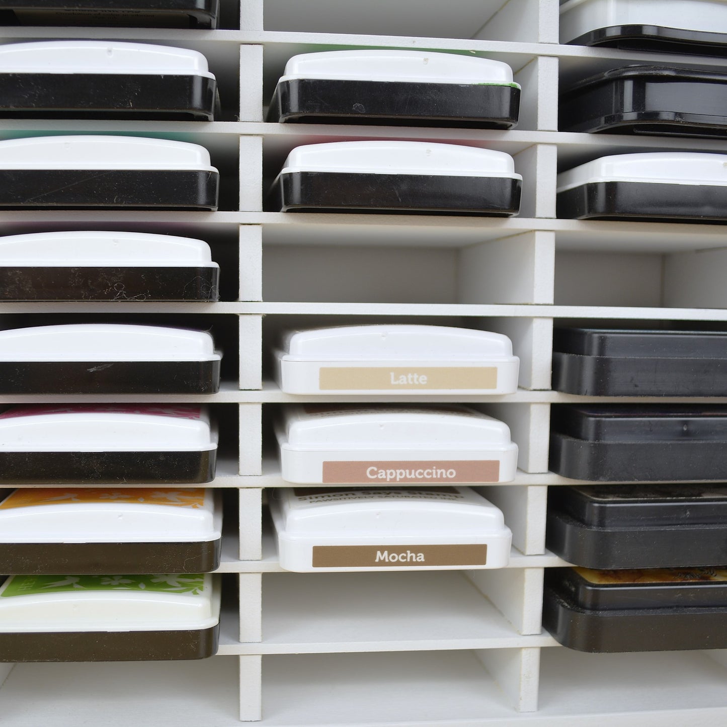 Closeup view of ink pads in a 36 slot ink pad holder from OrganizeMore.