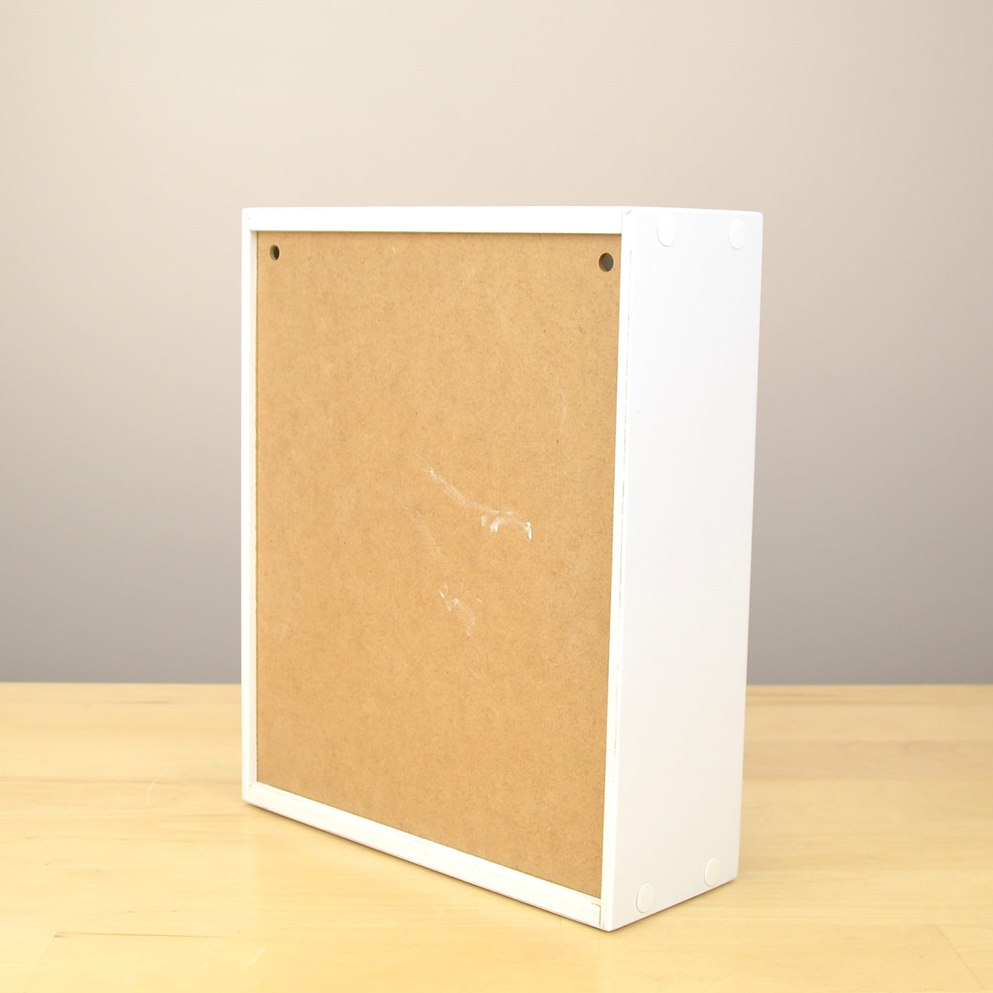 Back view of an ink pad organizer showing the holes for all mounting.