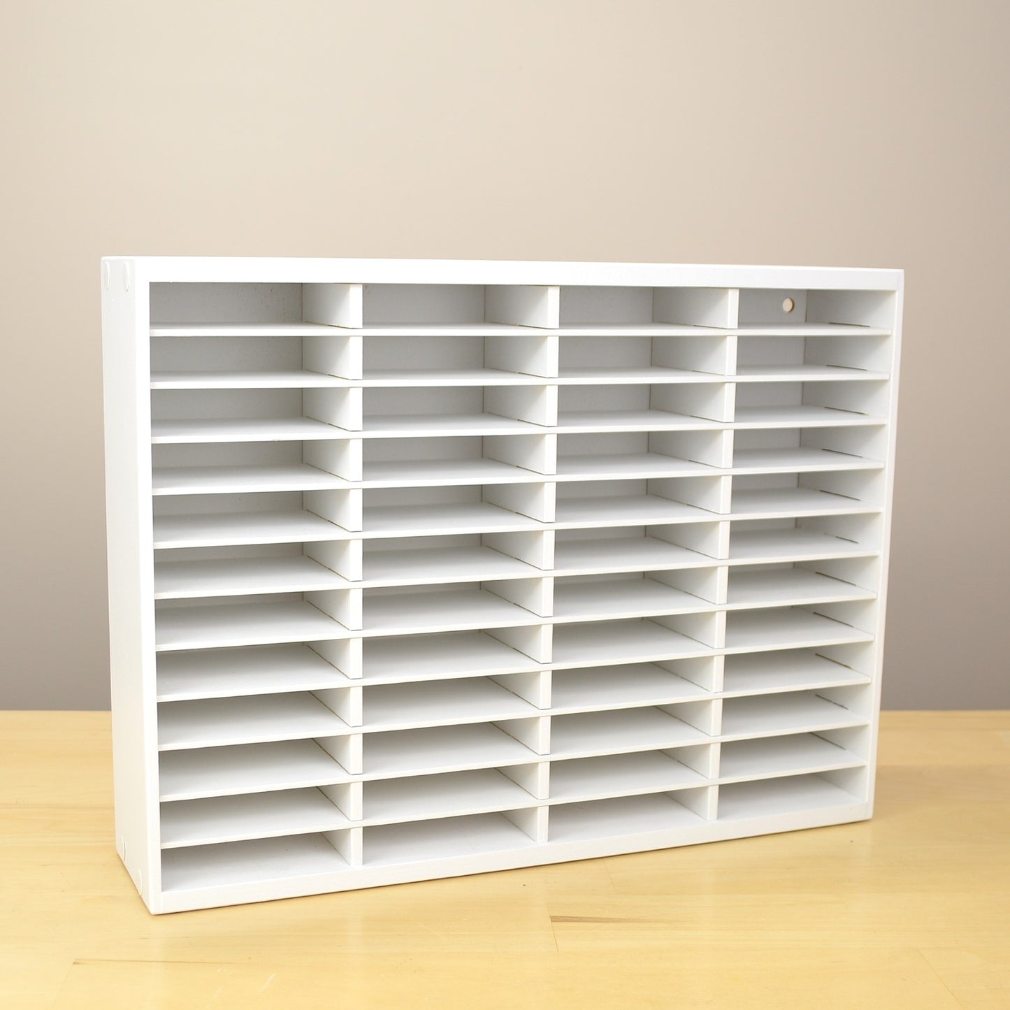 Angle view of an empty organizer made for Stampin Up ink pads with 48 slots.