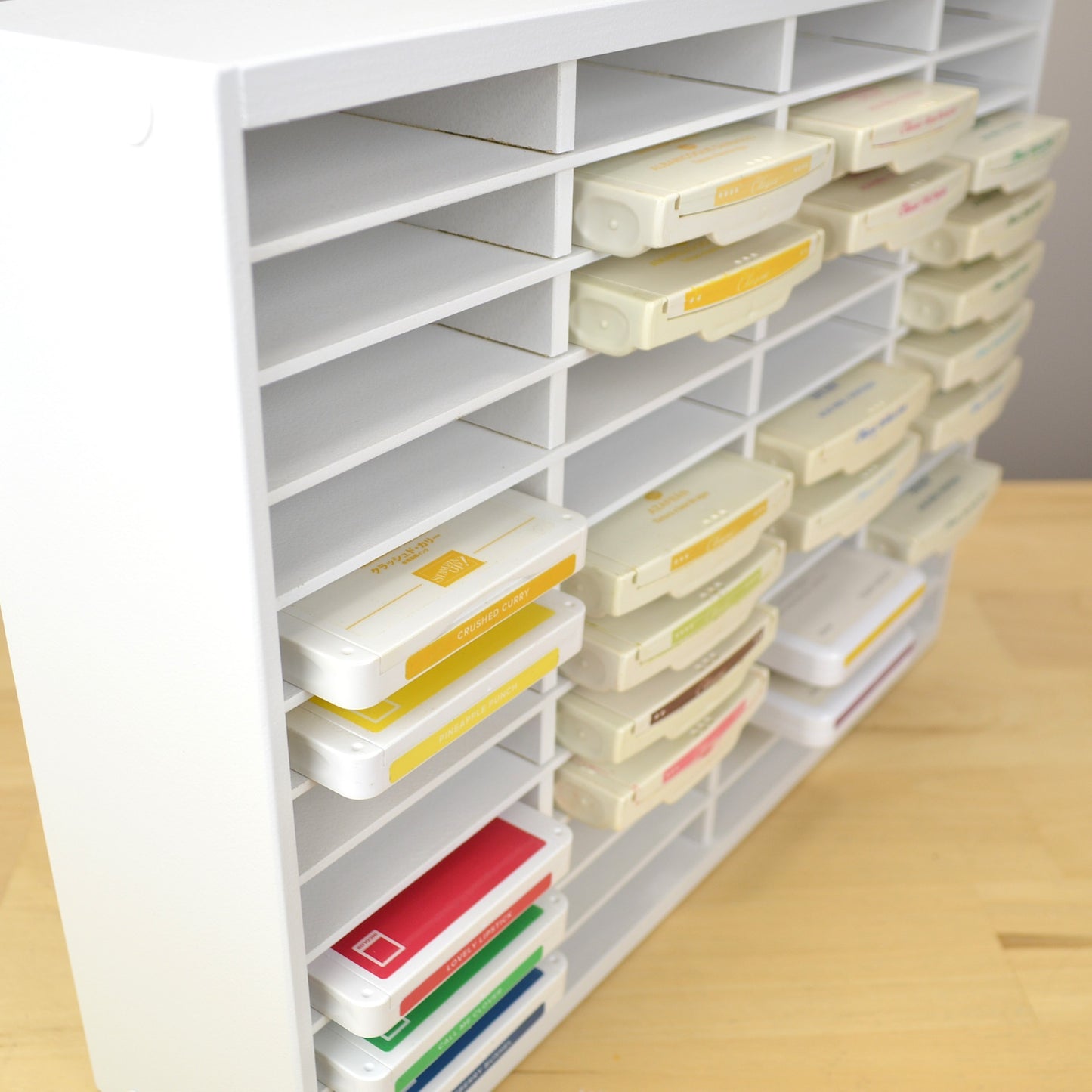 Angle view showing ink pads sticking out of a storage organizer from OrganizeMore.