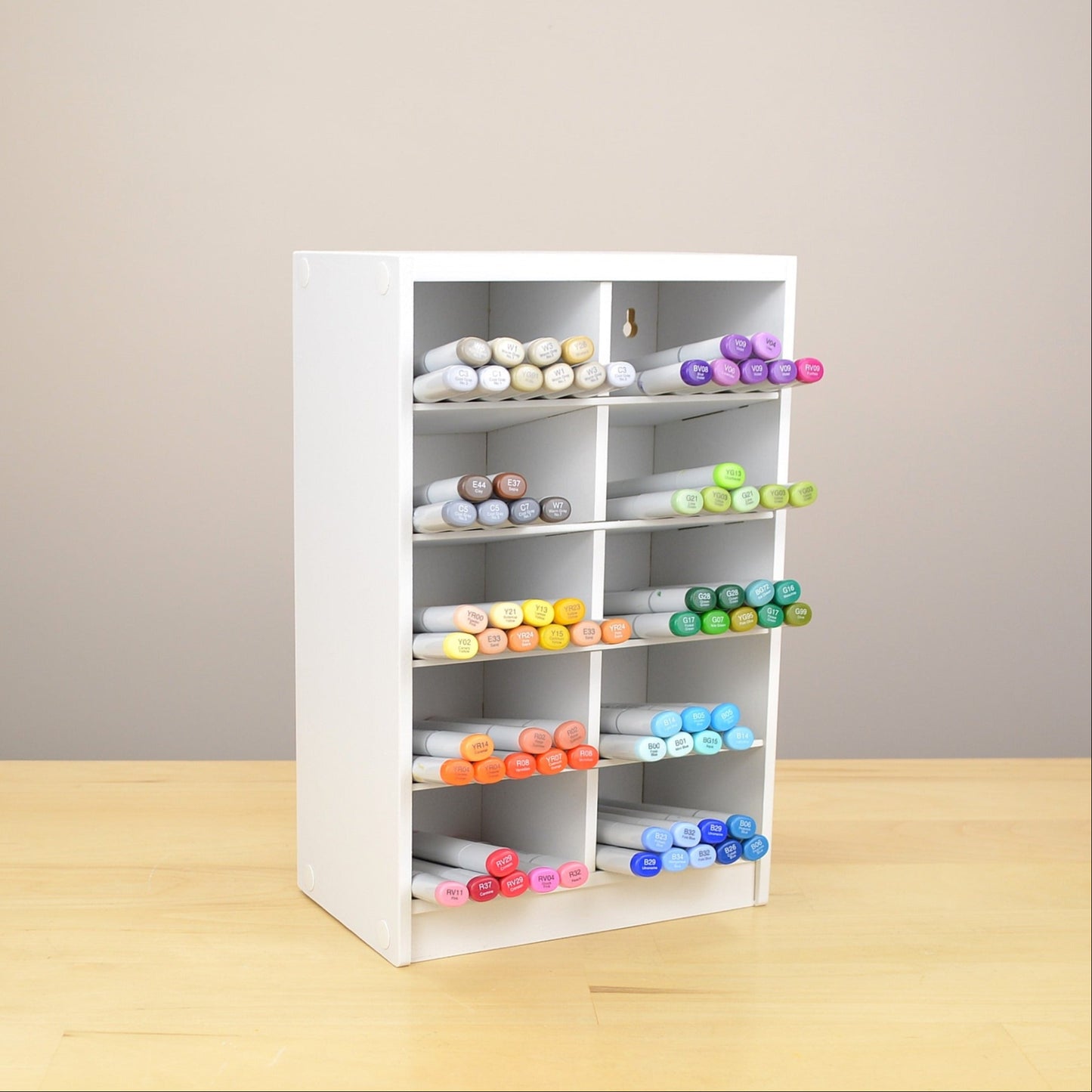 The Large Marker Organizer from OrganizeMore holding colorful Copic markers.