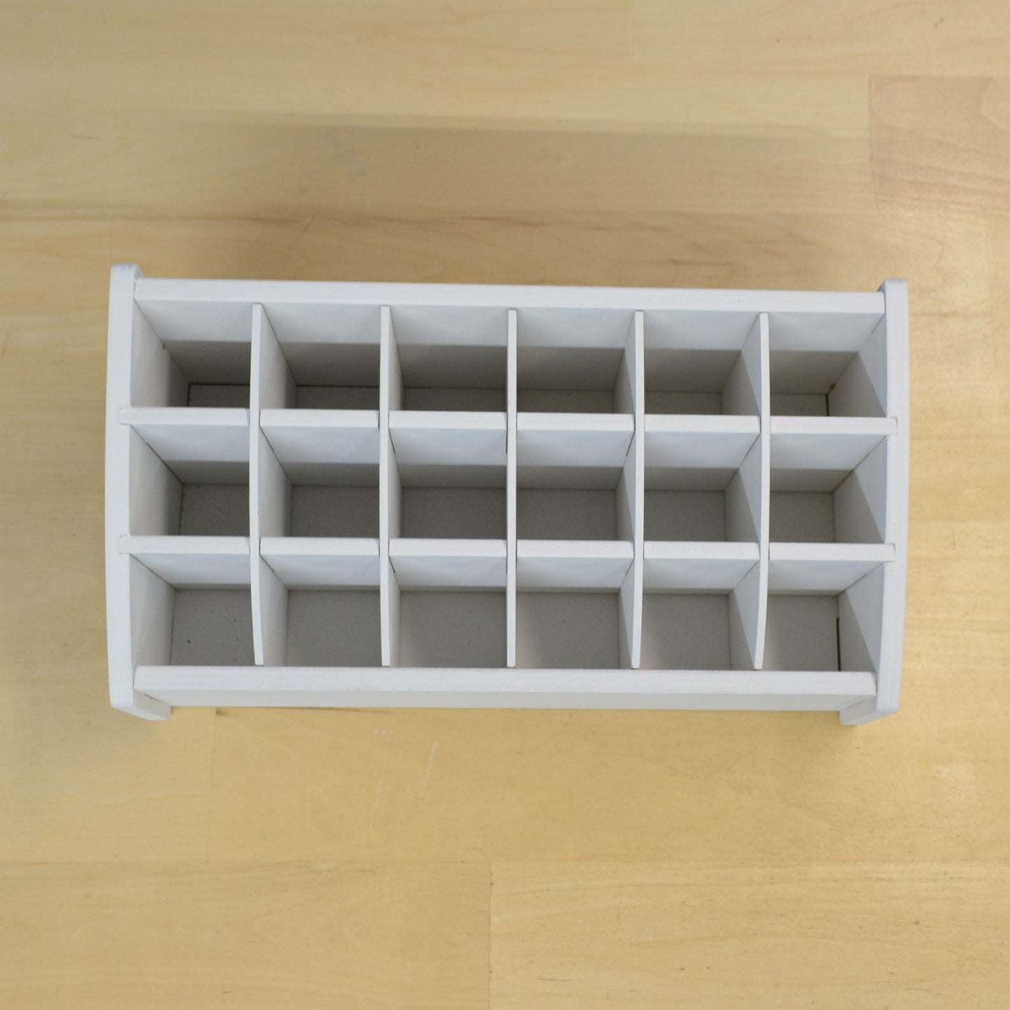 top view on an empty craft tool caddy showing the square spacing and eighteen individual sections