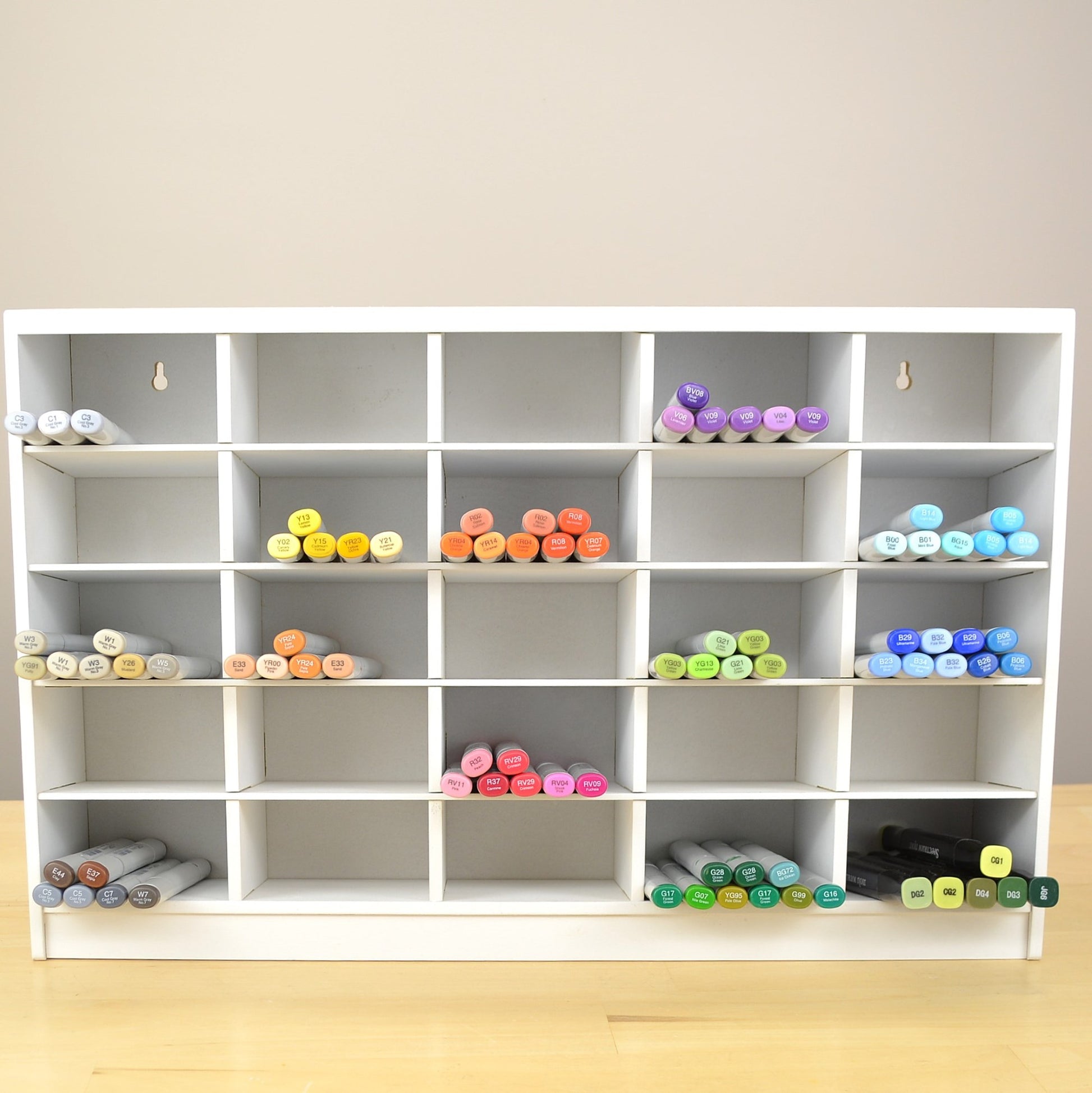 Front view of a white marker organizer designed to hold 600 Copics.