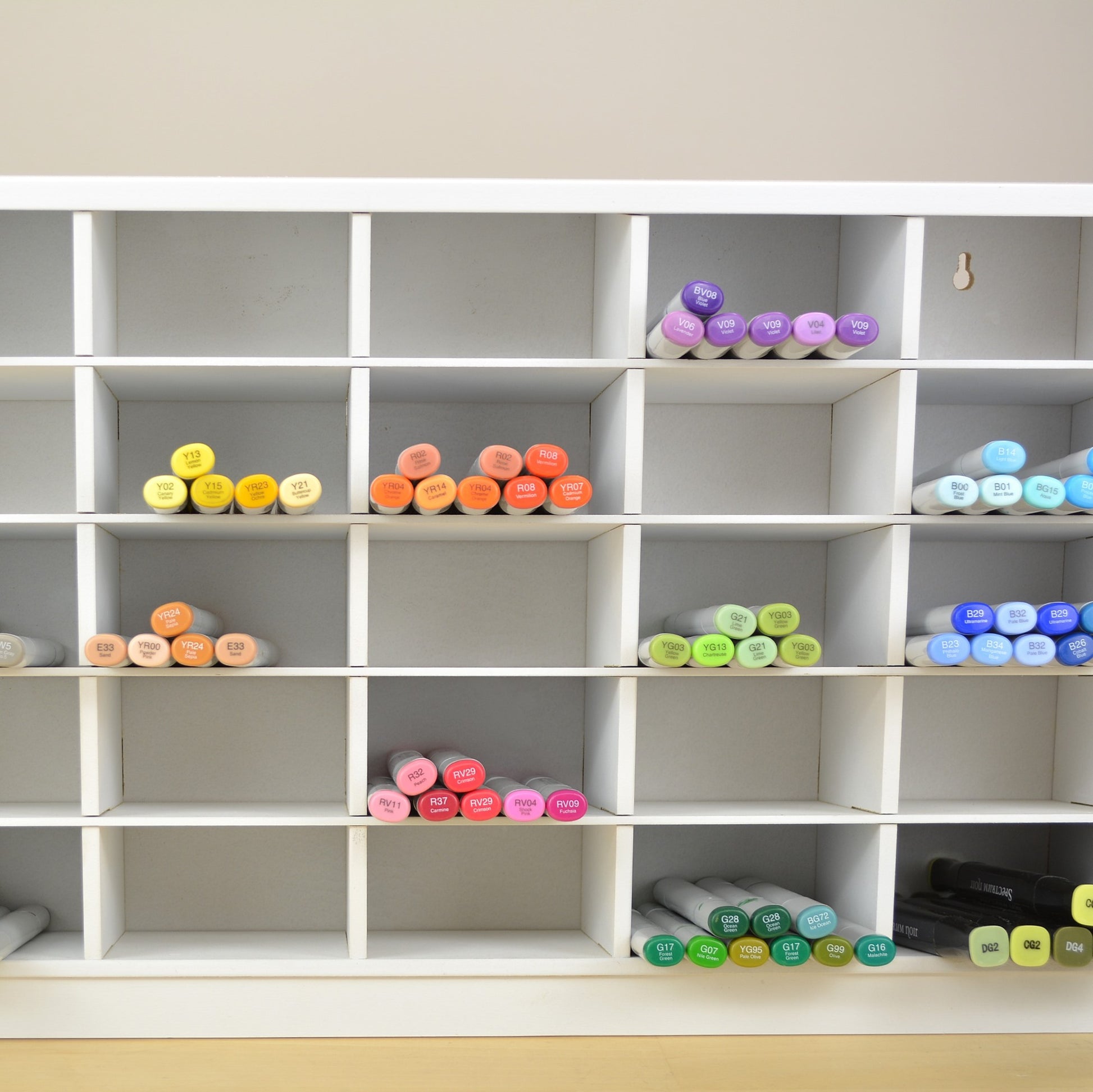 Front view showing colorful Copic markers in the Ultimate Marker Organizer from OrganizeMore.