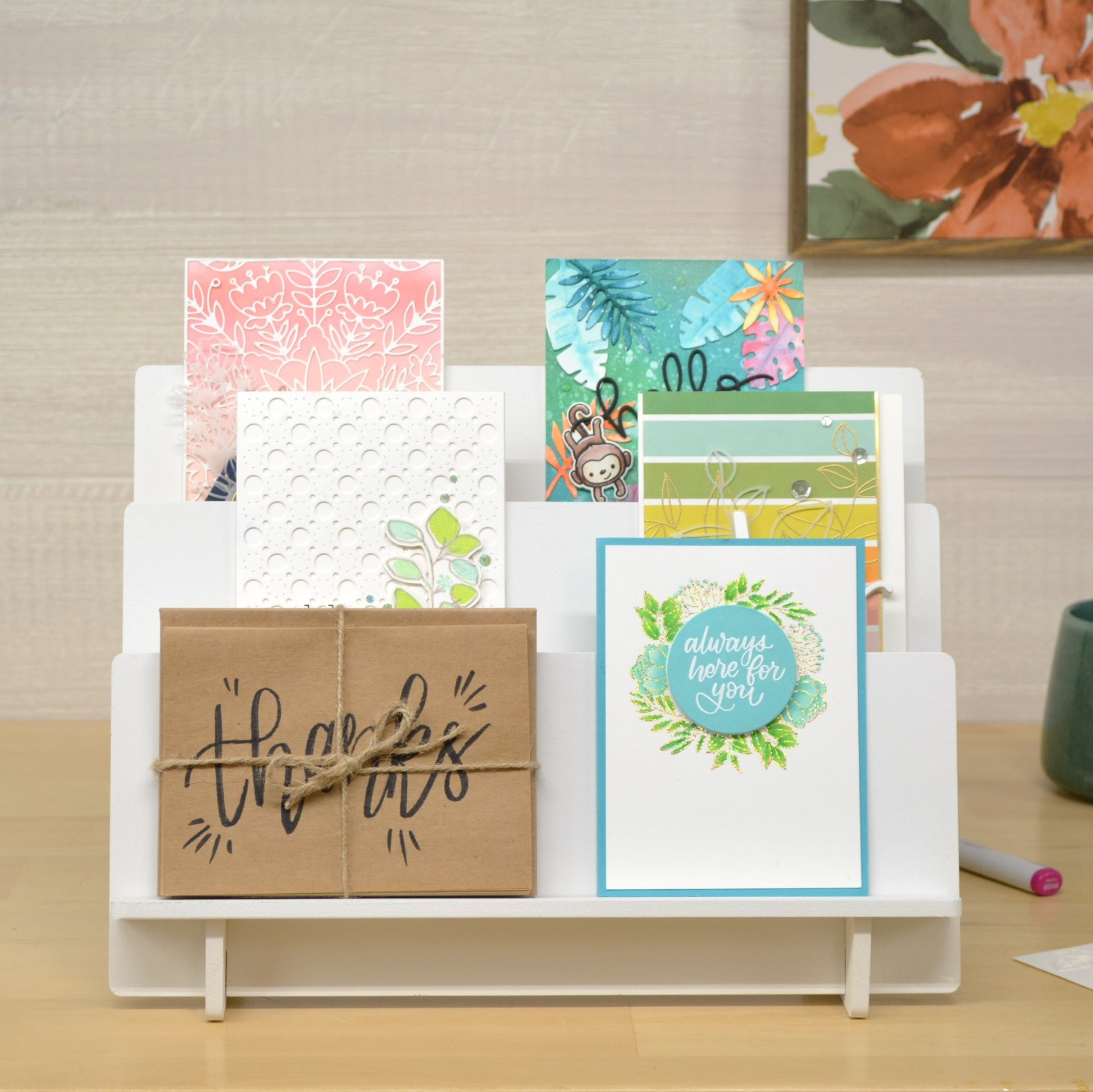 tiered shelf front view holding beautiful handmade greeting cards