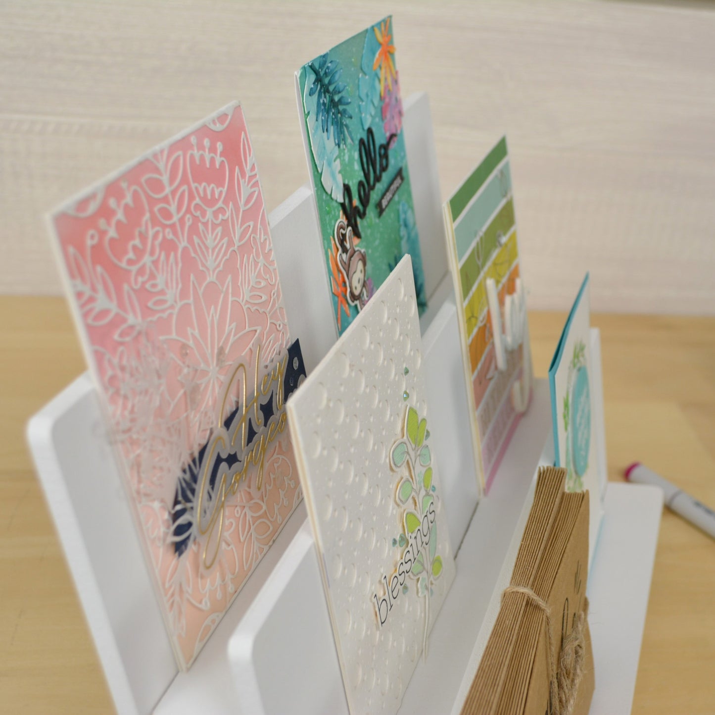 a card display stand closeup showing the spacing between the three tiered shelves