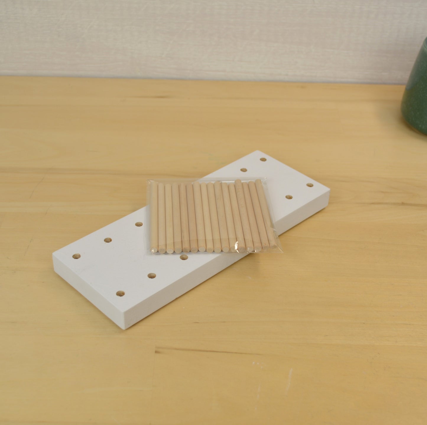desktop card organizer with holes and the pack of dowels that are included