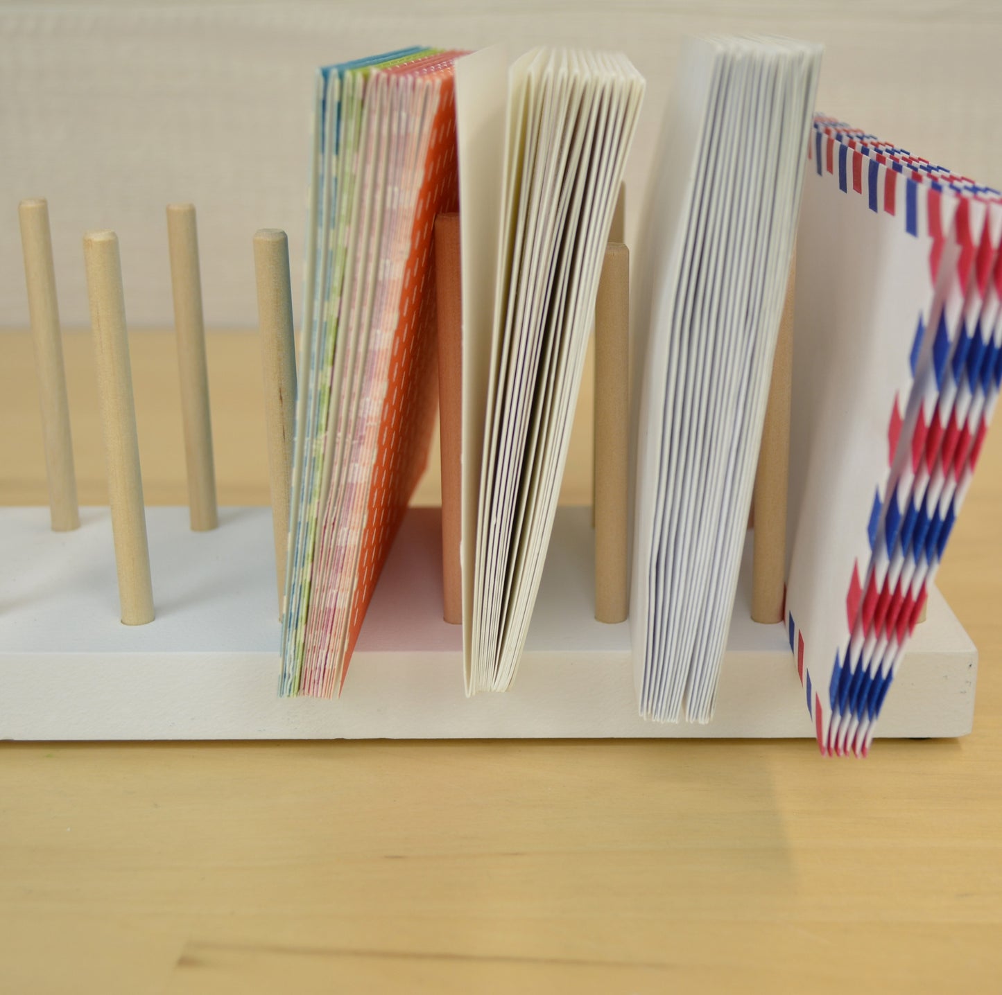 side view of a desktop organizer holding cards and envelopes