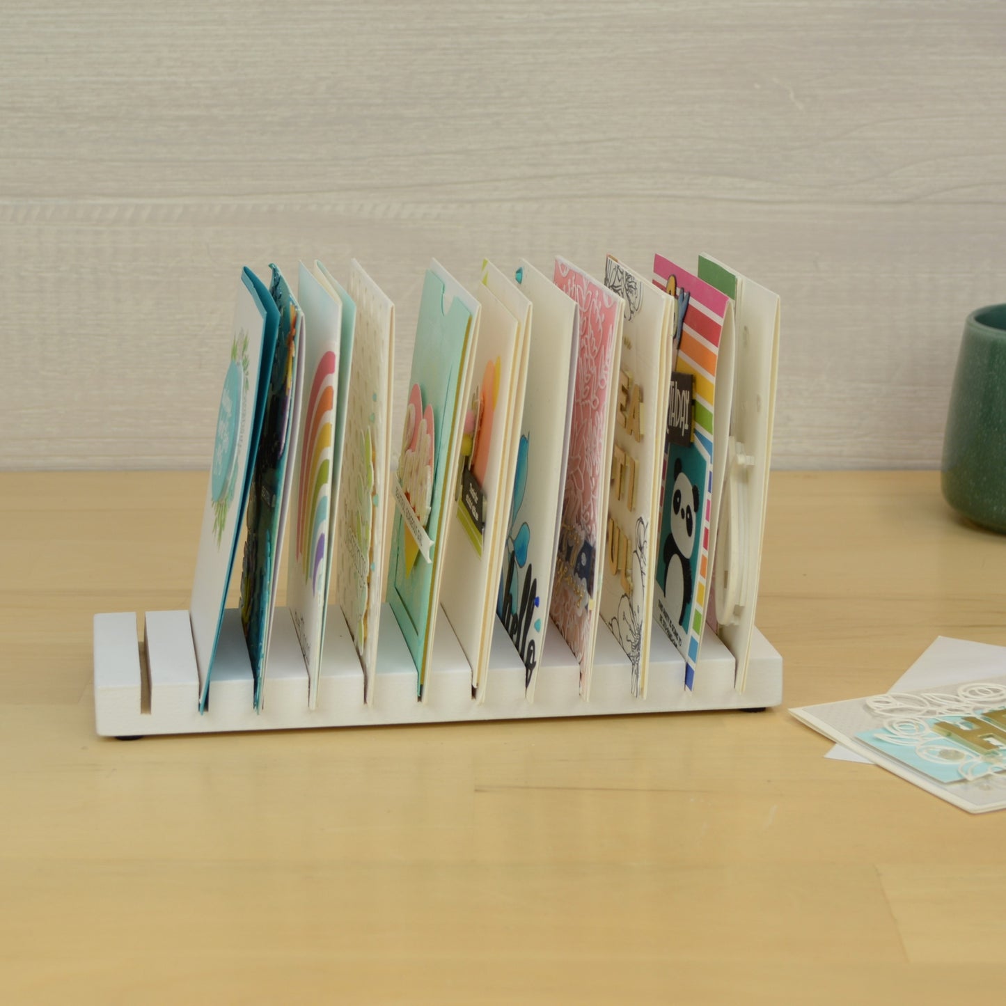 side view of a card drying rack full of greeting cards
