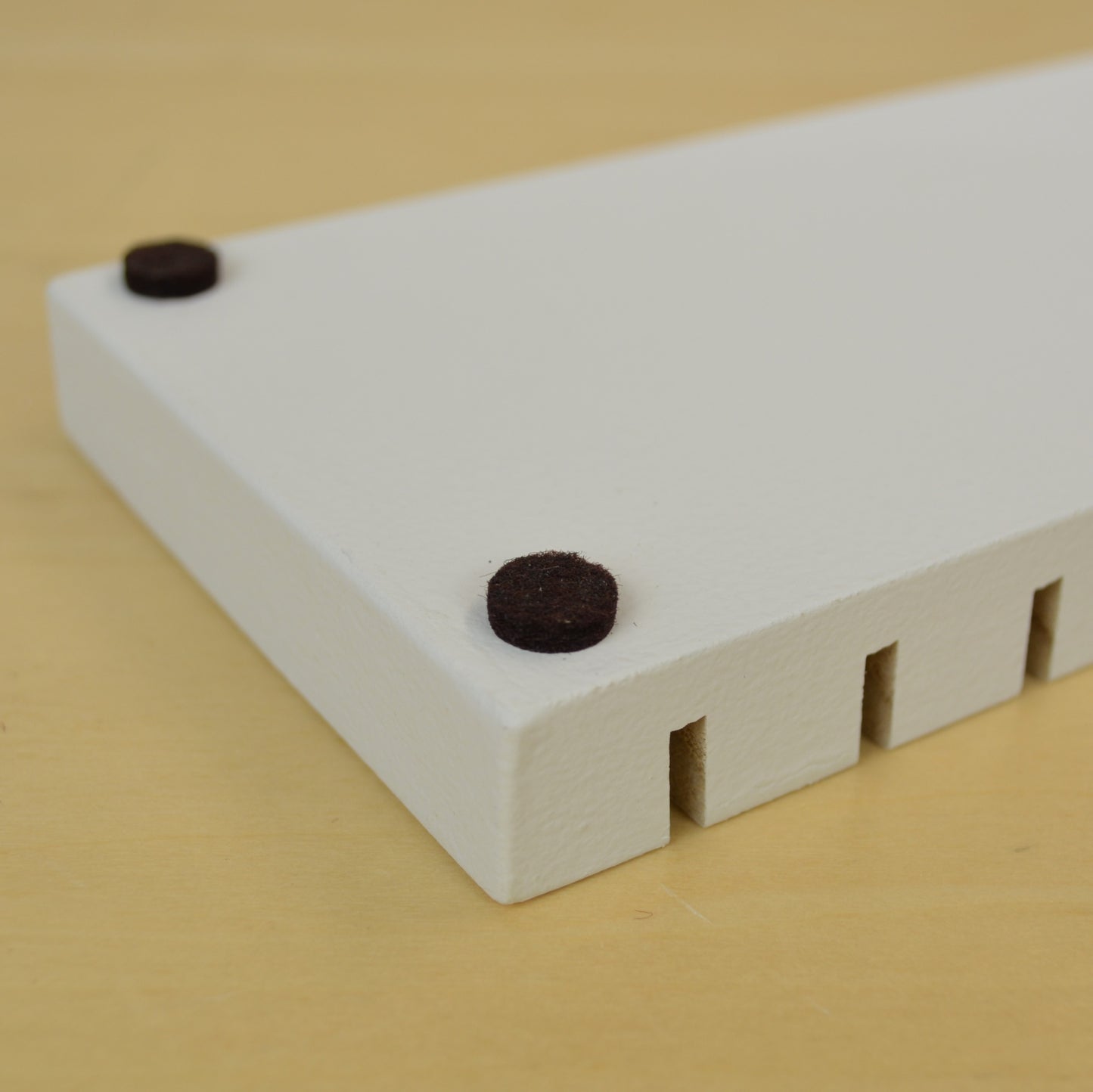bottom view of a card drying rack showing the felt feet