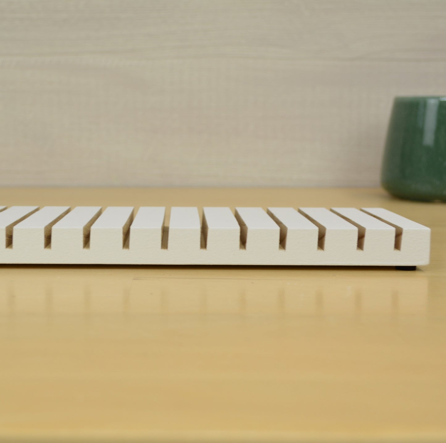 side view showing the grooves in a card drying rack that holds greeting cards