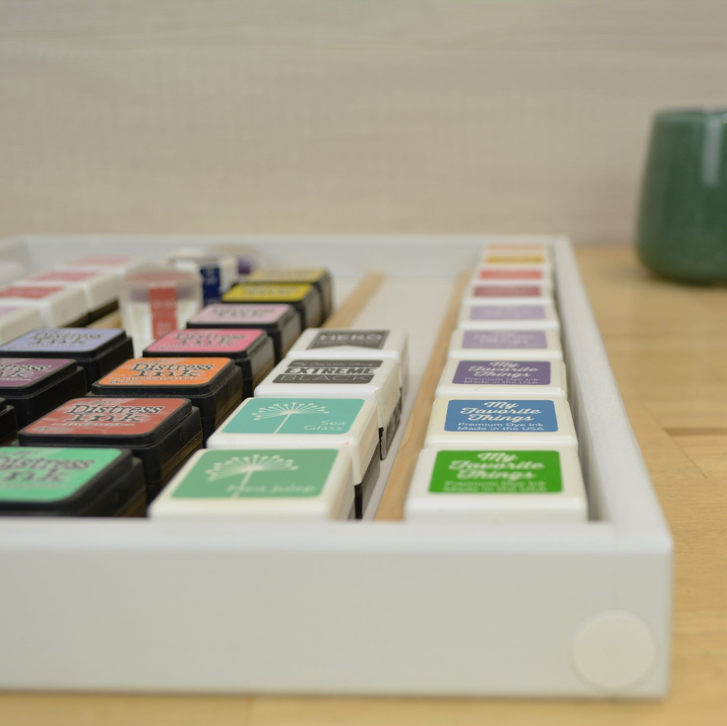 End view of rows of mini ink cubes n a divided tray.