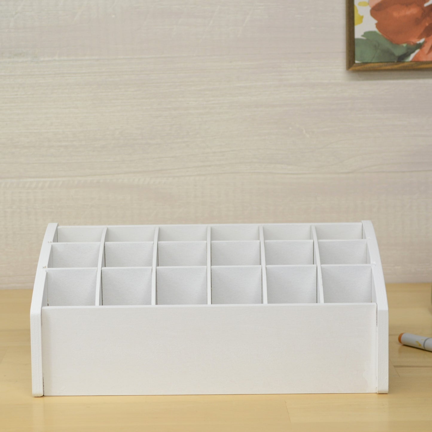 front view of a desktop organizer with individual cubbies made for craft and hobby tools