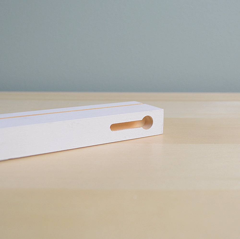 closeup of a keyhole slot in a floating shelf