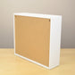 Back view of an ink pad organizer showing the holes for wall mounting. 