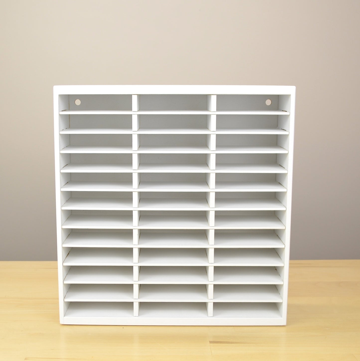 Direct view of an empty white ink pad organizer made by OrganizeMore. 