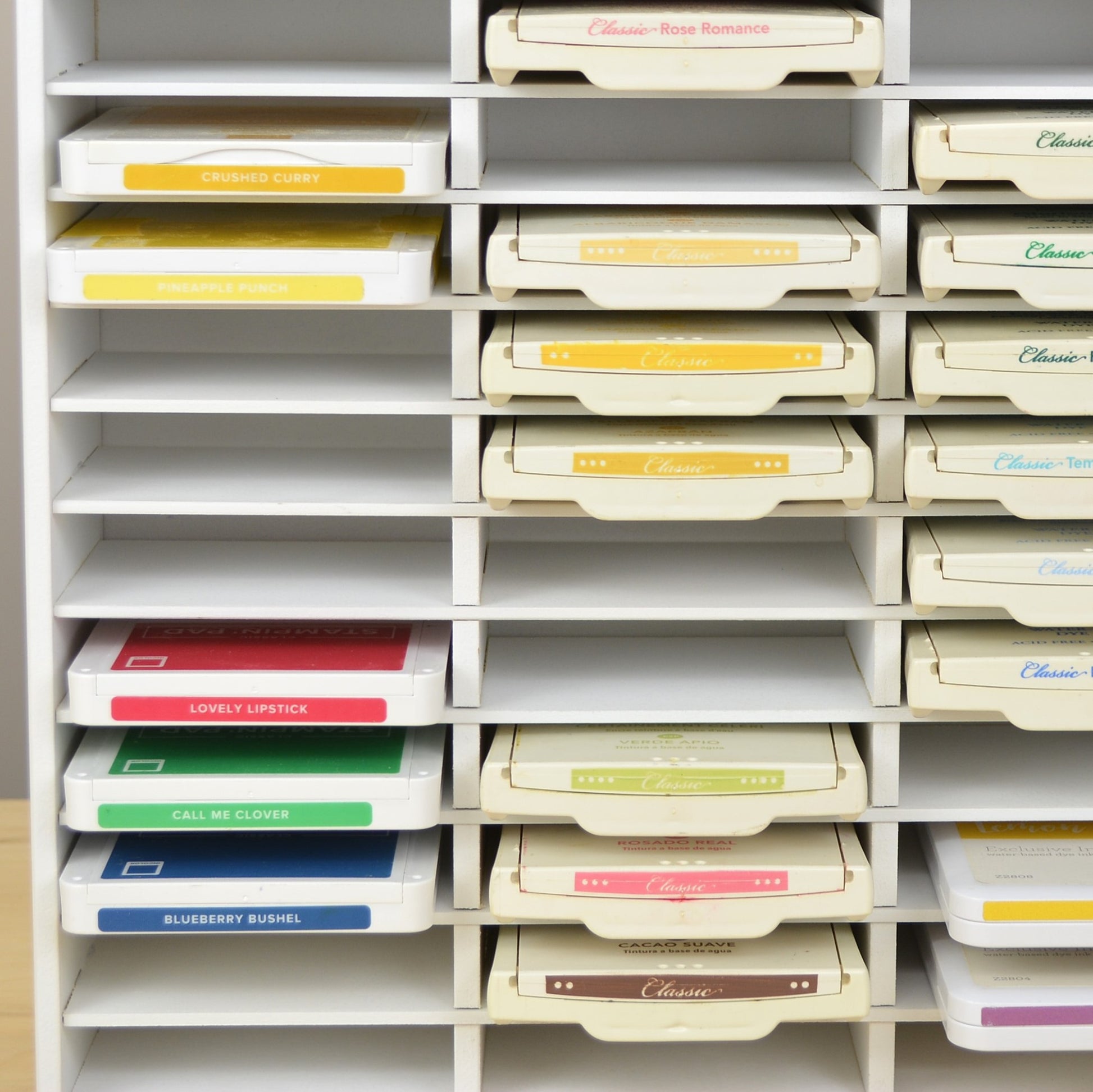 Closeup view of Stampin Up ink pads in a white storage organizer. 