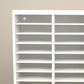 Closeup view of an ink pad holder showing the holes for wall mounting. 