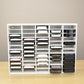 Ink pads in a white storage organizer that's designed for standard sized inks. 