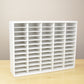 A white ink pad storage organizer that's made to hold 60 standard size pads. 