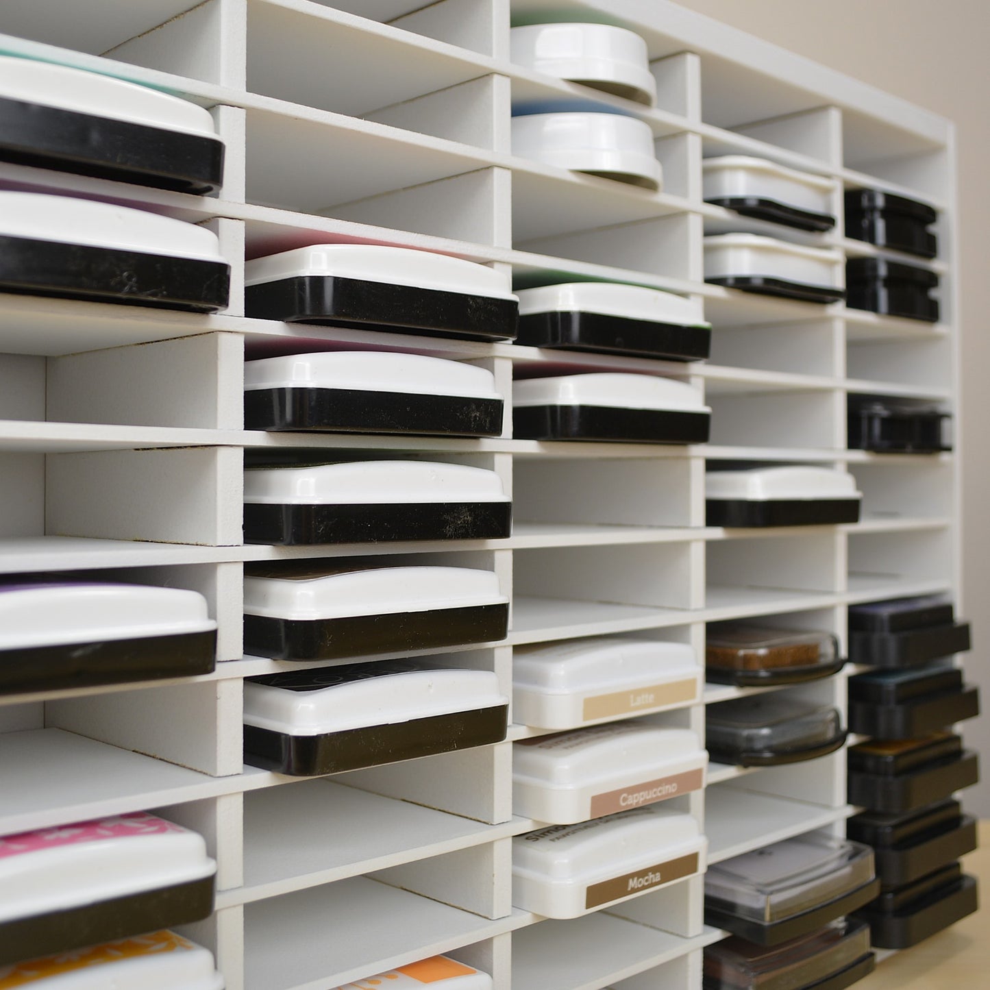 View of ink pads in a storage organizer showing how far the inks stick out. 