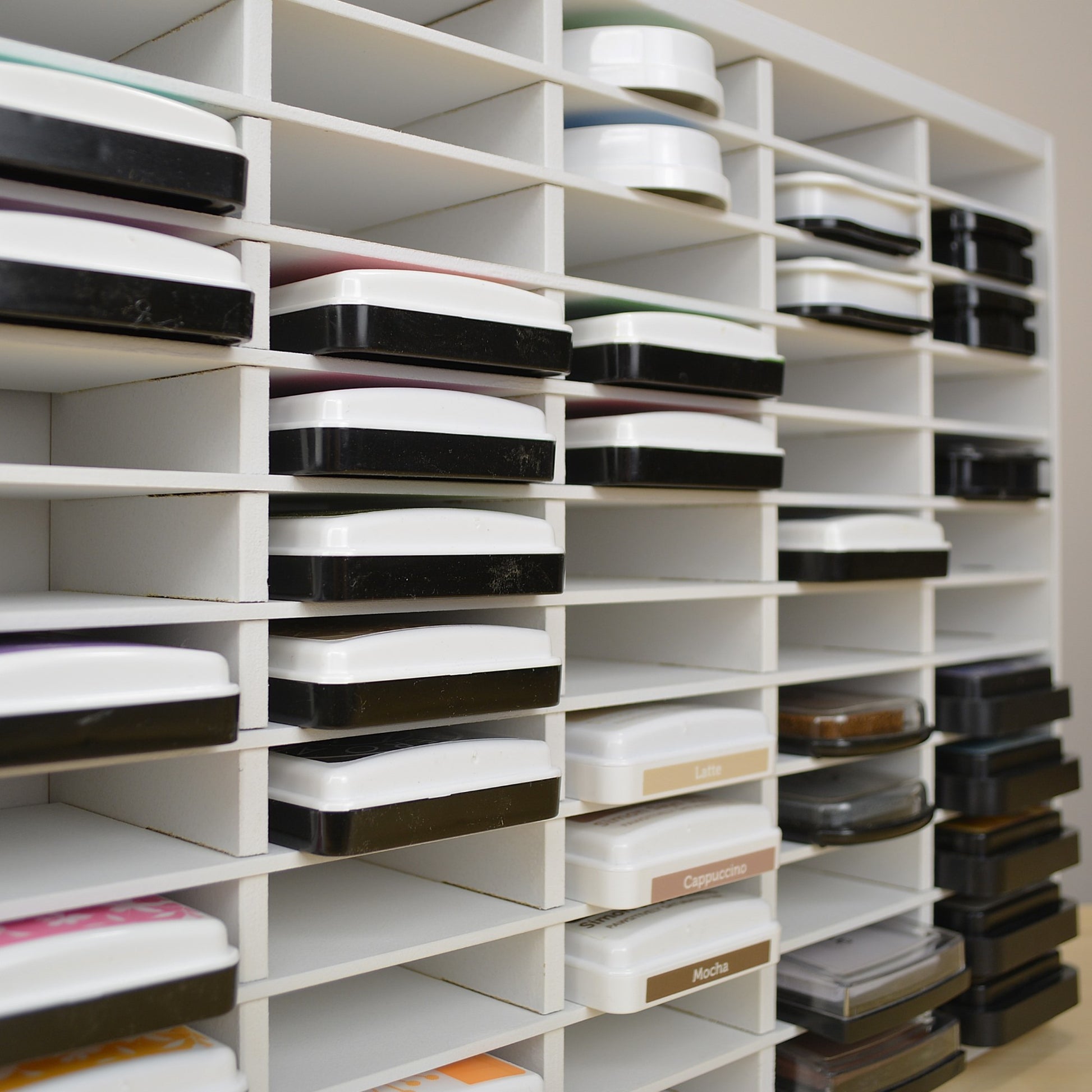 View of ink pads in a storage organizer showing how far the inks stick out. 