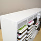 Detailed view of a white storage organizer showing the corner and top. 