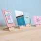 little wooden easels holding handmade greeting cards