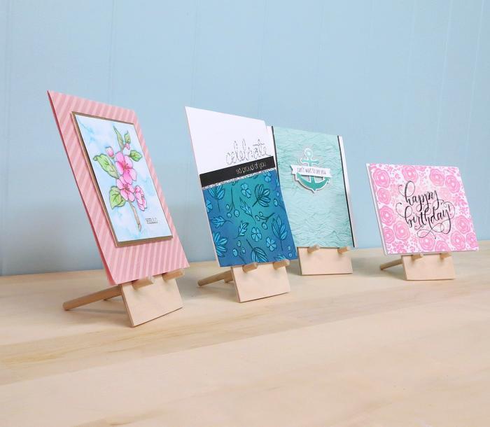 little wooden easels holding handmade greeting cards