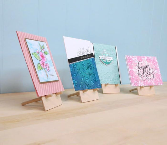 little wooden easels holding handmade greeting cards