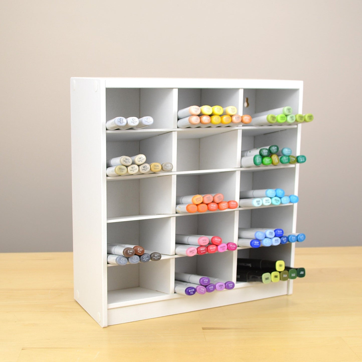 A white Pro Marker Organizer for Copics, made by OrganizeMore. 