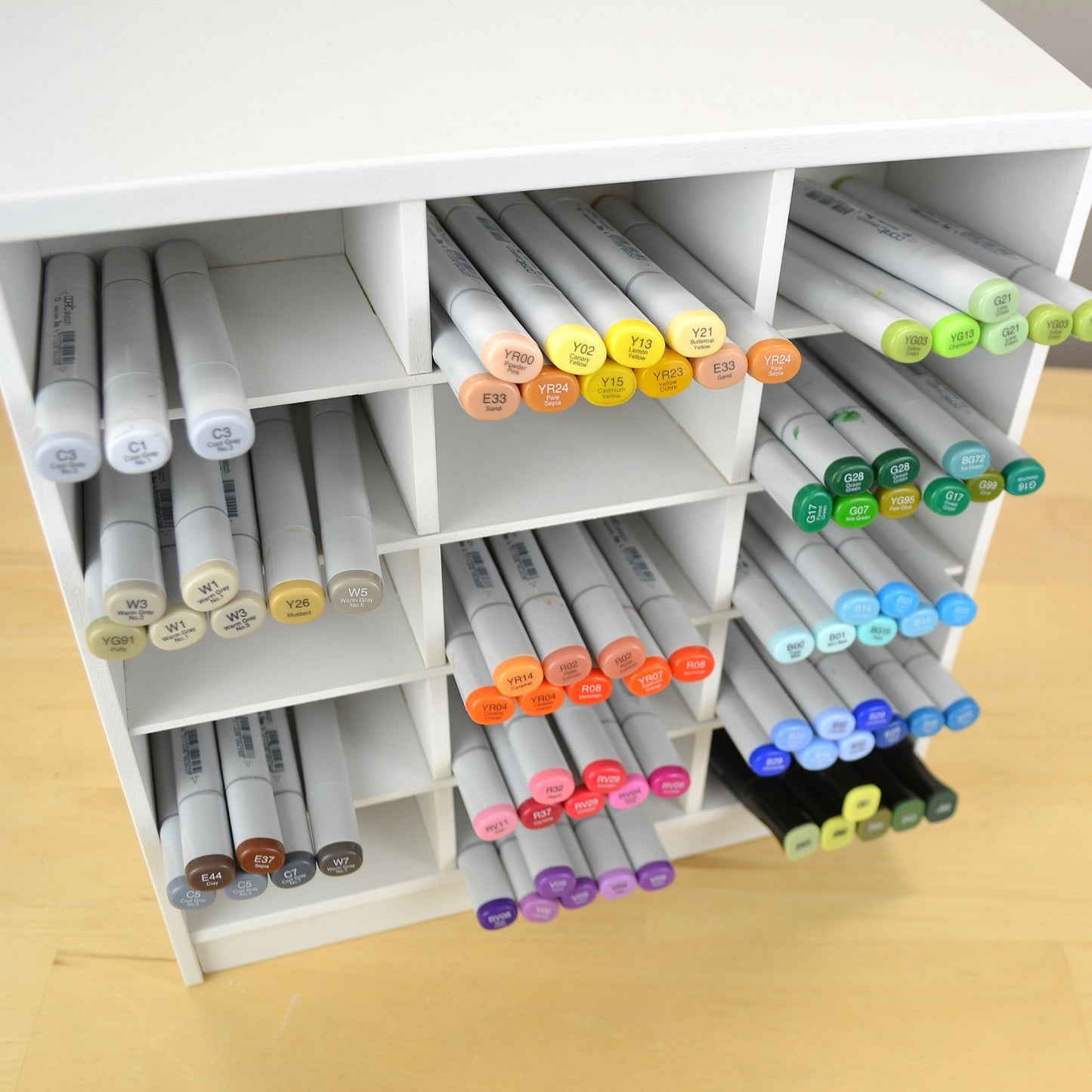 Top view showing how Copic markers stick out of the white organizer. 