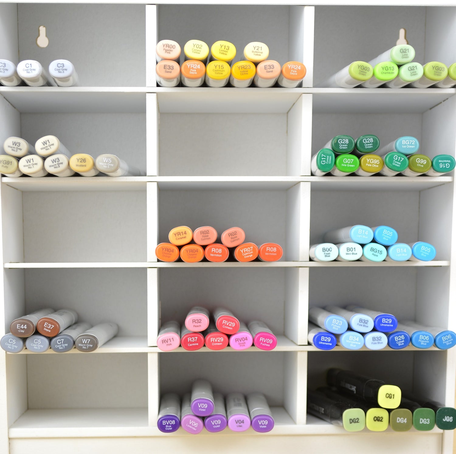 Front view of colorful markers in a white organizer by OrganizeMore. 