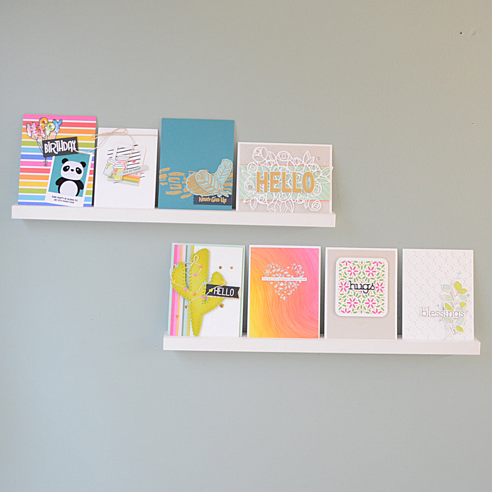 front view of greeting cards on floating shelves