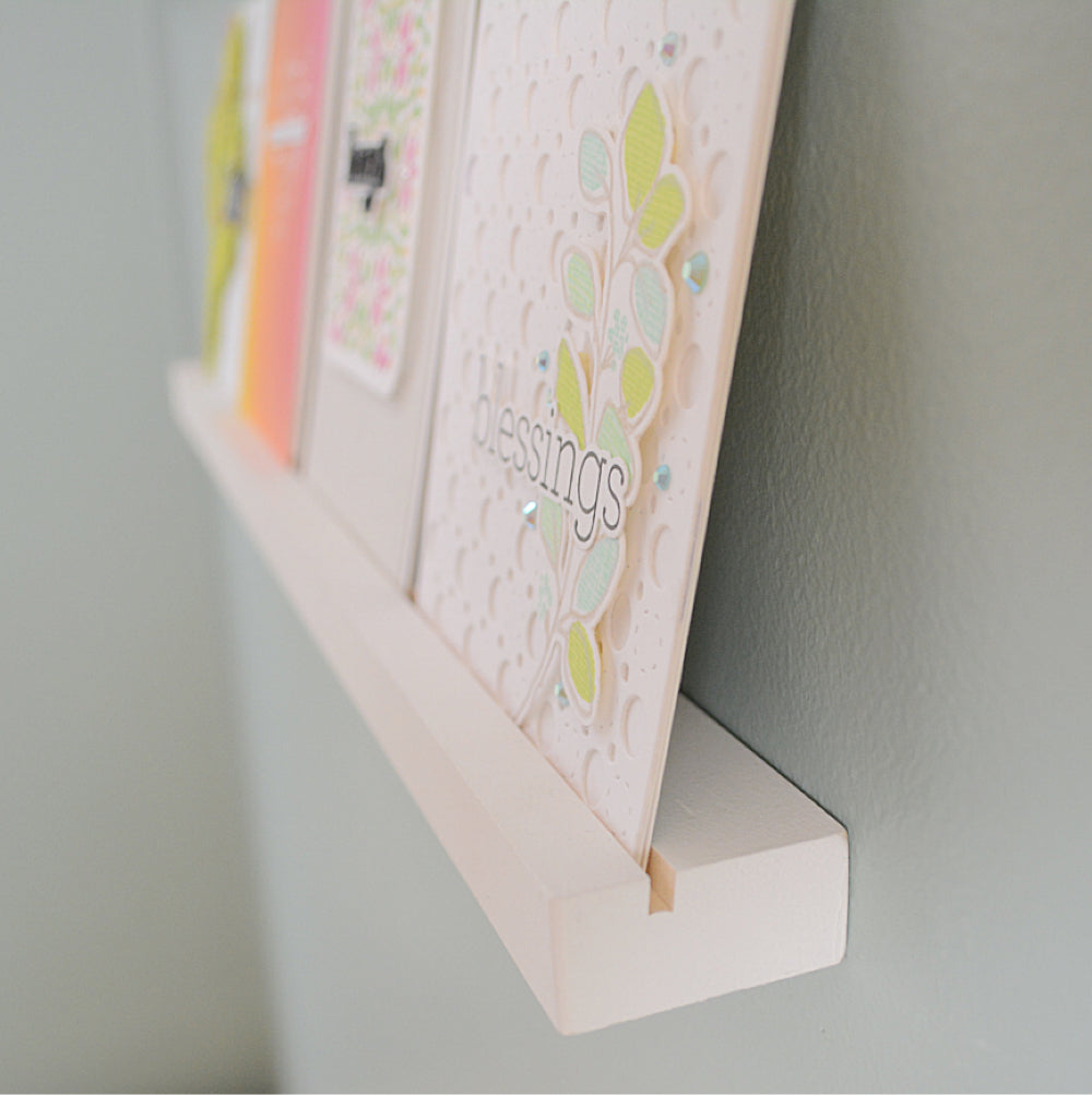 closeup view of a greeting card on a floating shelf