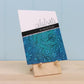 Main photo of one Card Easel. This handcrafted organizer holding a hand stamped card.