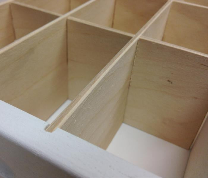 A close up of the wooden inserts where the journaling cards go.