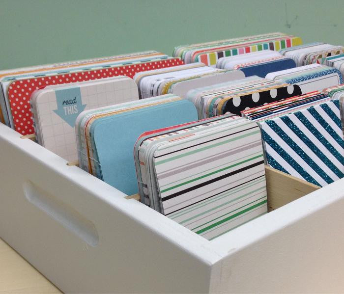 A close up of the front corner of the organizer. The side handles are shown.