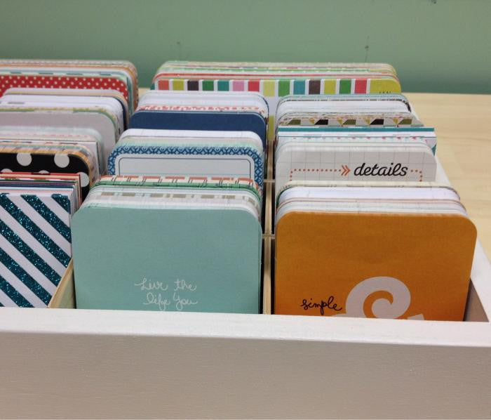 A straight ahead view of the journaling cards organized in the cubby.